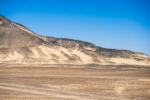 Black desert lanscape and basalt formarions — Stock Photo, Image