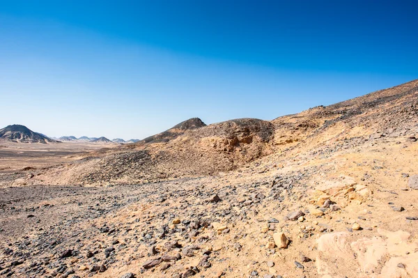 Black desert lanscape and basalt formarions — Stock Photo, Image