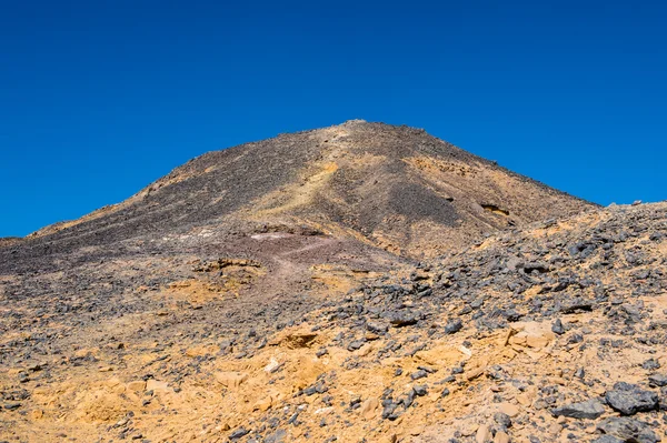 Black desert lanscape and basalt formarions — Stock Photo, Image