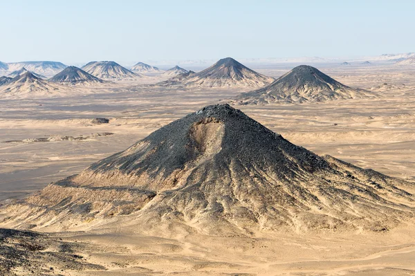 Black desert lanscape and basalt formarions — Stock Photo, Image