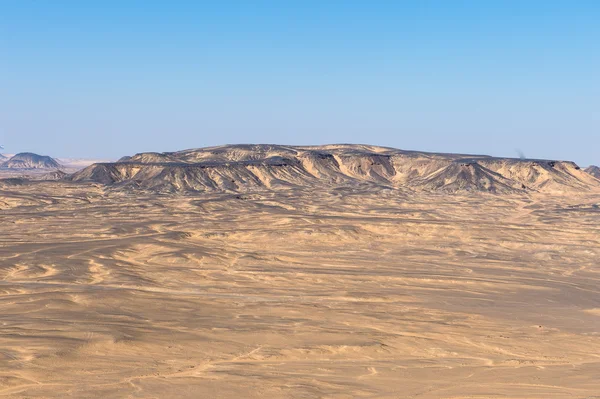 Black desert lanscape and basalt formarions — Stock Photo, Image