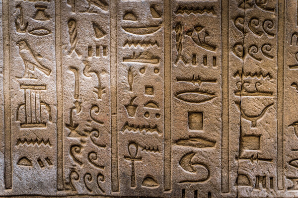 Egyptian hieroglyphs on the wall of the Horus temple in Egypt