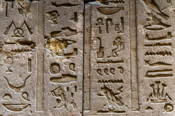 Egyptian hieroglyphs on the wall in the Sobek temple in Kom Ombo, Egypt