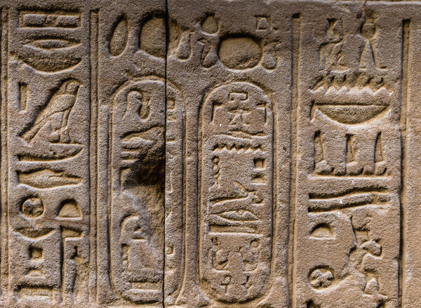 Egyptian hieroglyphs on the wall in the Sobek temple in Kom Ombo, Egypt