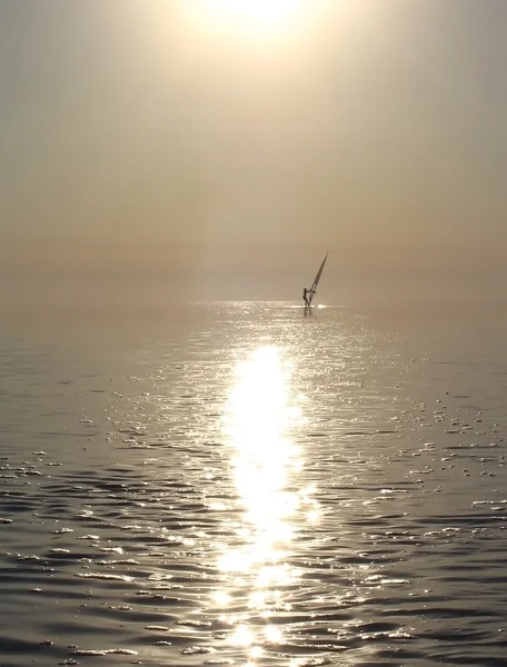 Windsurfer in the sea at sunset — ストック写真