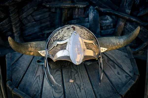 Old knight helmet on the wooden stand — Stock Photo, Image