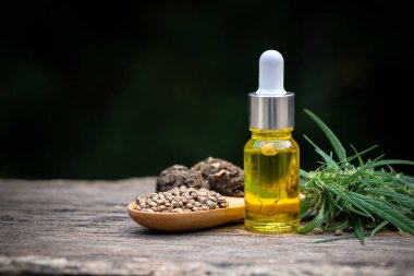 CBD hemp oil  products,  Cannabis oil against Marijuana plant. Herbal Treatment, Alternative Medicine clipart