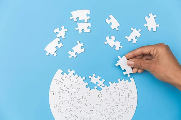 Jigsaw connection, Jigsaw puzzle in the hand of a businessman,  Business team assembling Jigsaw puzzle.