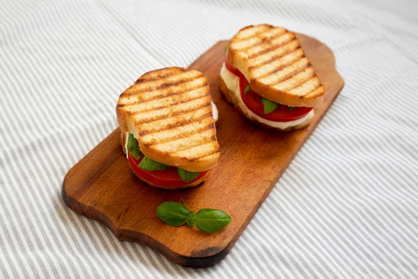 Tasty Grilled Caprese Panini Mozzarella Tomatoes Basil Rustic Wooden Board — Stock Photo, Image