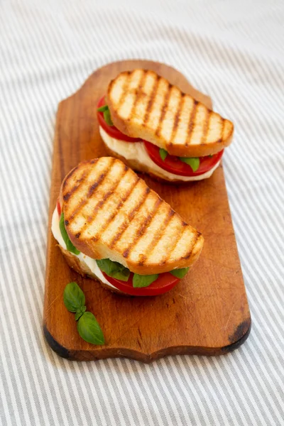 Tasty Grilled Caprese Panini Mozzarella Tomatoes Basil Rustic Wooden Board — Stock Photo, Image