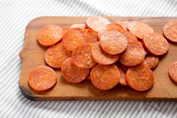 Italian Pepperoni Slices Rustic Wooden Board Cloth Side View — Stock Photo, Image