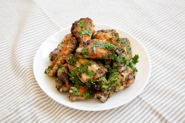 Homemade Baked Garlic Parmesan Chicken Wings White Plate Low Angle — Stock Photo, Image