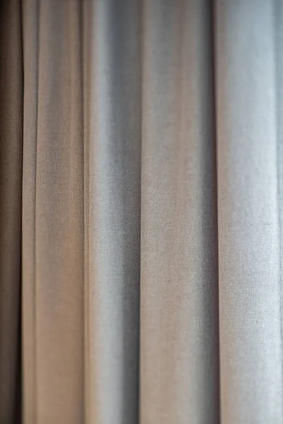 Close-up of grey curtains. Fabric texture. Modern interior. Protect the sunlight in interior.