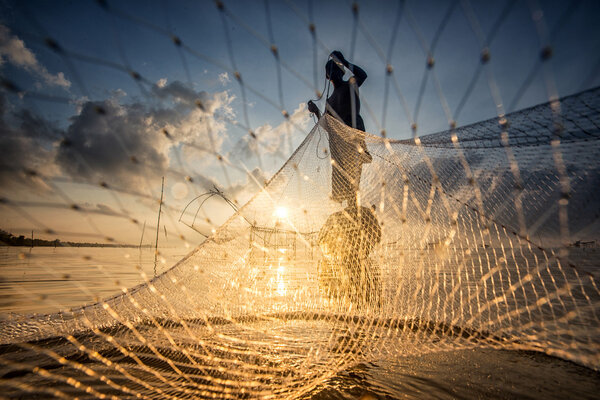 Landscape of Pakpra with fisherman in sunrise at Phatthalung, Th