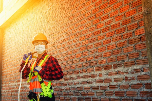 Worker man with safety helmet Construction building industry, new home, construction interior service concepts - Selective focus