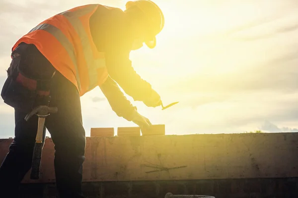 Worker man with safety helmet Construction building industry, new home, construction interior service concepts - Selective focus