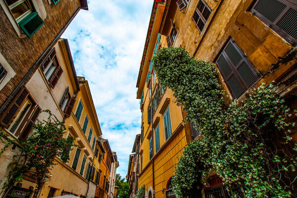 Cozy old streets in Trastevere in may 2021, Rome, Italy. Trastevere neighborhood of Rome, on the west bank of the Tiber, architecture and landmark of the city of Rome, Lazio, Europe