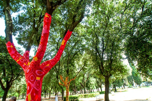 Artist Yarn Bombing by Accademia Aracne with his knitted trees  at the exhibition \'Back to nature\' 2021, installations of contemporary artists in Villa Borghese in Rome , June 13, 2021 in Rome, Italy, Europe