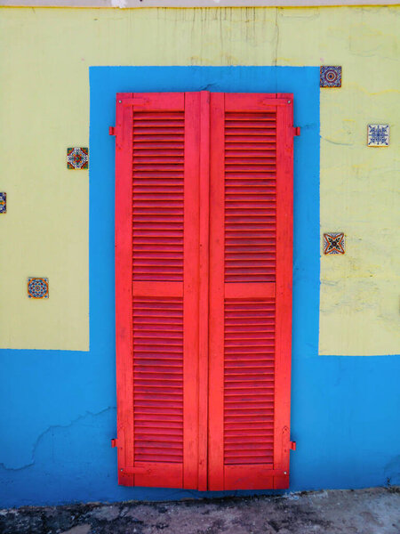 Colorful doors and windows of the restaurant pizzeria inside the swimming pool center in Olmedo, summer 2021, Sassari, Sardinia, Italy