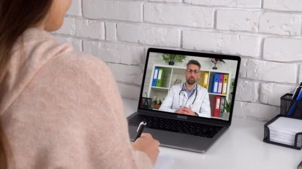 Doctor in laptop screen Consults online conference video call computer webcam — Stock video