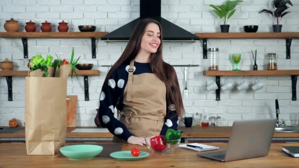 Woman greets listen tells teacher study online video call laptop in kitchen — Stock Video