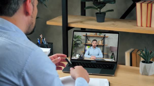 Businessman at home office tells manager online video call webcam chat laptop — Stock Video