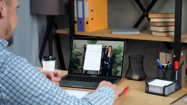 Man at home office study tells teacher online video call chat webcam laptop — Stock Video