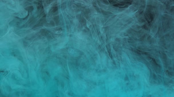 Turquoise blue ink acrylic paint mixing in water, swirling softly underwater — Stock Video