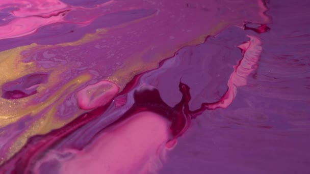 Purple, pink, lilac, maroon and gold colors mix. Paint movement, Ink flow. Glitter fluid motion. Moving flowing stream of liquid paint — Video