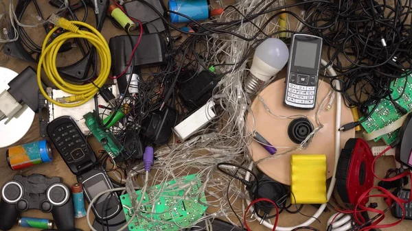 E-waste and Hazardous waste sorting and disposal. Old broken phones, battery, computers and electronics. Heavy metal pollution. Used electrical devices and obsolete electronic equipment