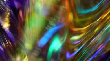 Futuristic glowing neon gold purple pink red blue abstract background. Hologram glitch. Light through a prism and smoke. Lens flare