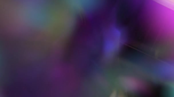 Light through crystal and prism. Hologram neon rainbow purple blue magenta pink prismatic blurred holiday texture — Video