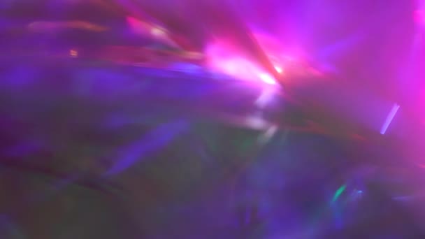Futuristic glowing neon purple pink magenta teal blue abstract background for holiday. Light through crystal and prism. Aurora effect lights — Stok video