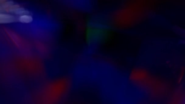 Light through a prism or diamond. Dark neon blue pink purple color rainbow gradient. Abstract holographic background. Hologram glitch — стоковое видео