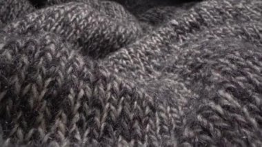 Makro kumaşlı, rahat koyun yünü kumaşı. El işi yün süveter örmek. Yumuşak tekstil soyut arkaplan. Kış moda endüstrisi. Ev konforu ve konfor