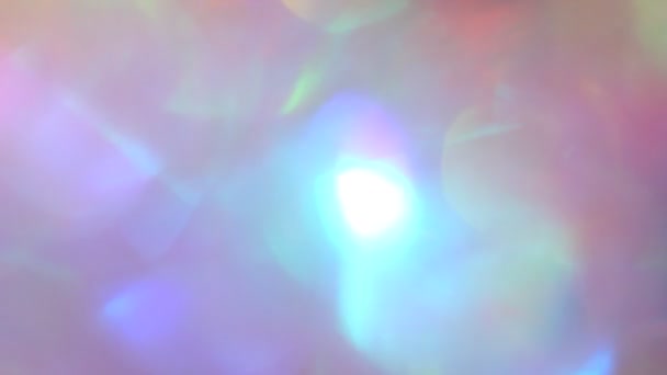 Iridescent holographique licorne arc-en-ciel lueur et bokeh. Festive abstraite brillant fond violet rose flou — Video