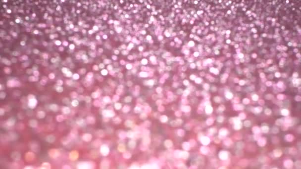 ピンクのキラキラお祝いの質感。休日のための素晴らしい背景。美しい魔法のボケ — ストック動画