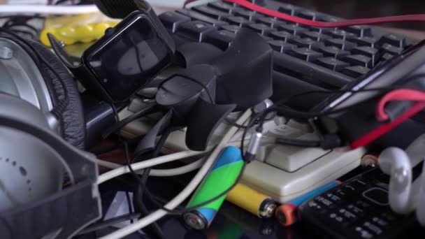 E-waste, Used electronics, Electronic scrap components, harmful materials. Recycling and disposal of e-waste. Broken phones, computers and wires — Stock Video