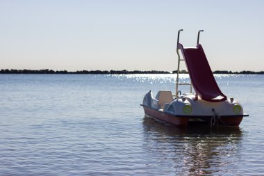 Pedal boat in the morning clipart