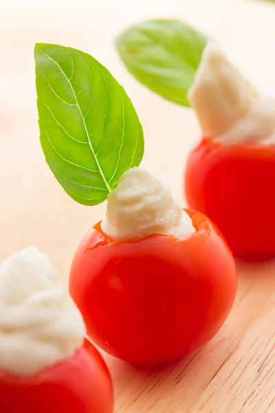 Cherry tomatoes with soft cheese — Stock Photo, Image