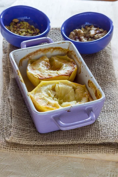 Baked apple with honey and pistachio nuts — Stock Photo, Image