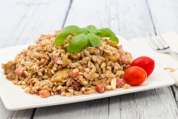 Spelt with mushrooms and bacon — Stock Photo, Image