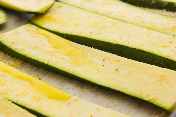 Sliced zucchinis ready to be baked — Stock Photo, Image