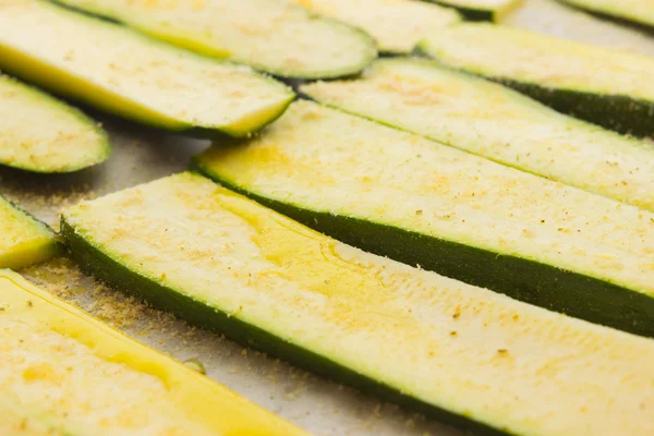 Sliced zucchinis ready to be baked — Stock Photo, Image