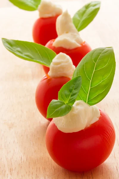 Cherry tomatoes with soft cheese — Stock Photo, Image