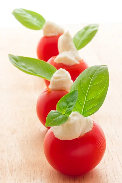 Cherry tomatoes with soft cheese — Stock Photo, Image