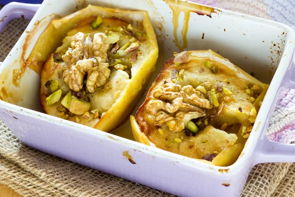 Baked apple with honey and pistachio nuts — Stock Photo, Image