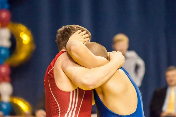 Men compete in freestyle wrestling