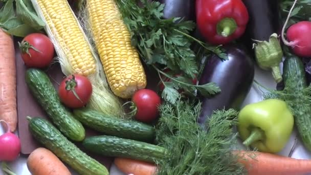 Fresh vegetables and greens on the kitchen table — Stock Video