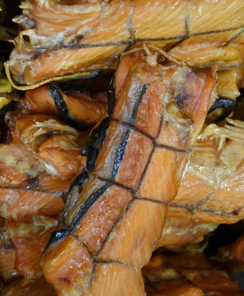 The ridges of the wild Pacific Chinook salmon (Latin. Oncorhynchus tshawytscha) hot smoked. Chinook salmon is the largest of the Pacific salmon.